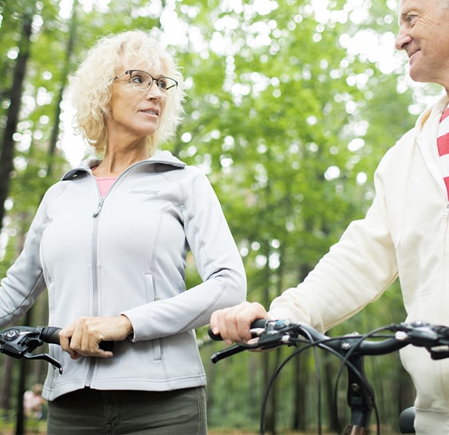 a senior couple riding bicycles
