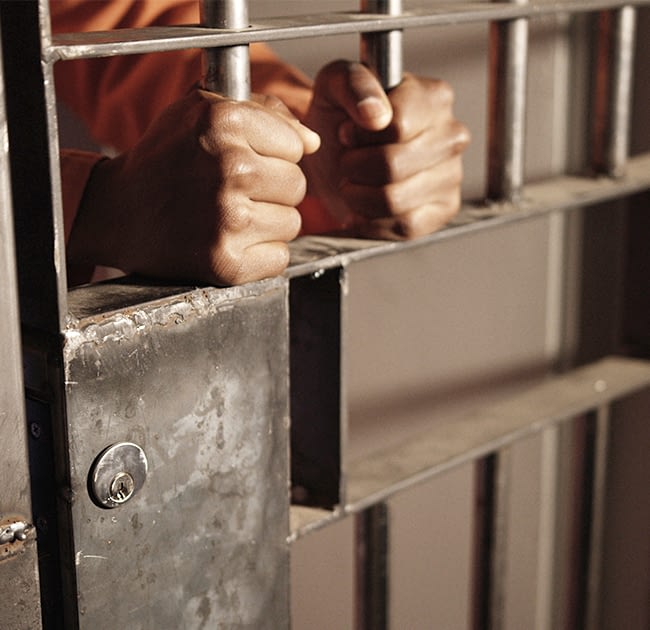 Man behind jail bars