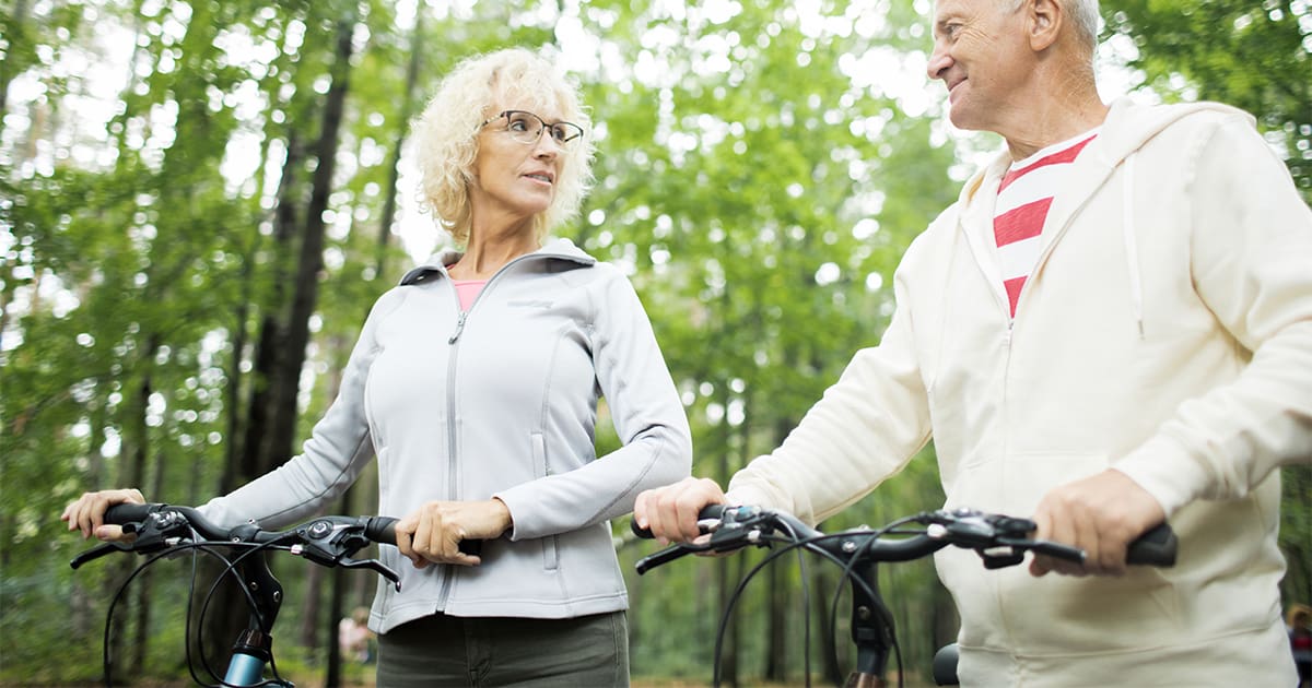 a senior couple riding bicycles