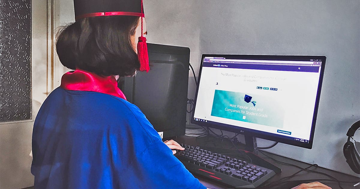 a female highschool student graduates online due to covid-19